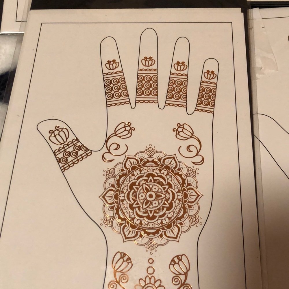 Metallic gold/rose gold henna design hand tattoos